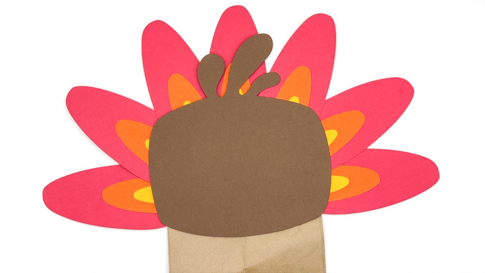 Add face to paper turkey craft