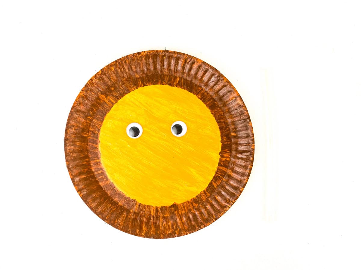 add googly eyes to middle of lion paper plate