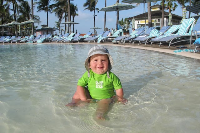 cute baby smiling at pool at Atlantis Bahamas