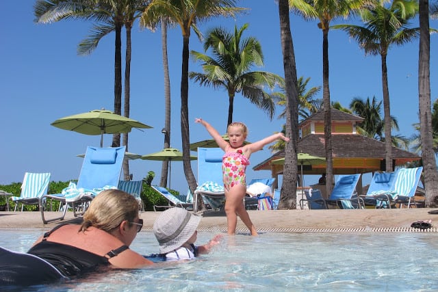 little girl dancing in the pool in Atlantis Bahamas