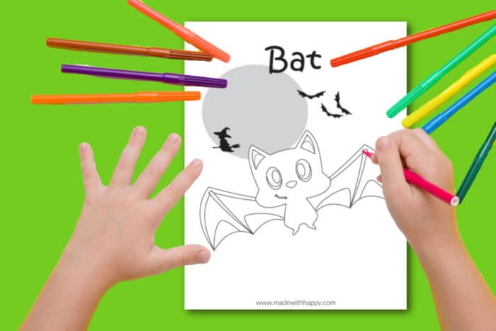 Child coloring a bat coloring page