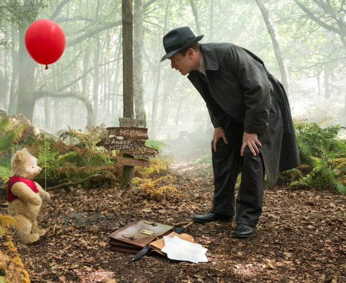 Christopher Robin (Ewan McGregor) with his longtime friend Winnie the Pooh in Disney’s live-action adventure CHRISTOPHER ROBIN.