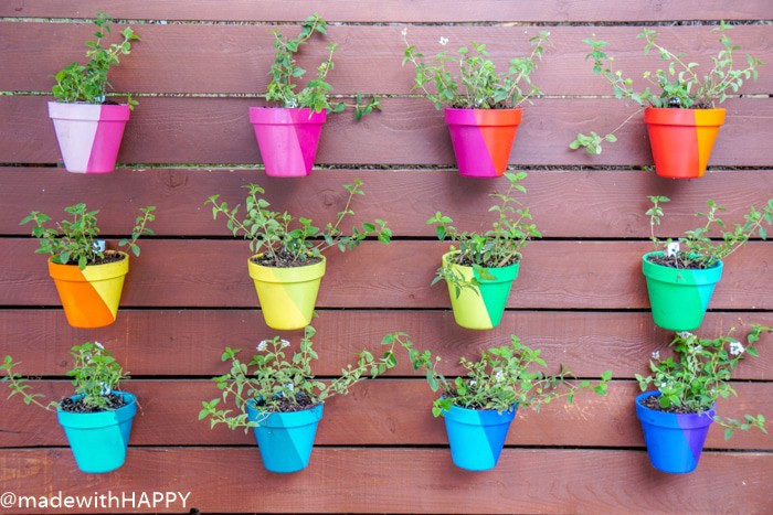 Rainbow Vertical Garden Hanging Pots. Color Blocking Flower Pots. Rainbow Vertical Garden. Colorful garden pots brighten up any outside space.