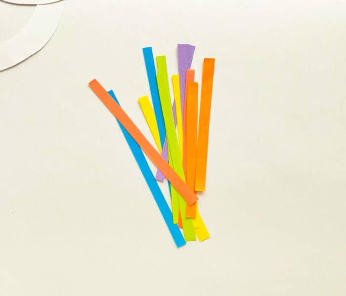 Cut out colorful paper strips.