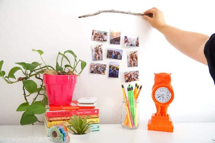 This modern picture display is a fun and simple to create.  Driftwood Picture Hang is a great way to bring natural elements to showing off your pictures.  www.madewithhappy.com