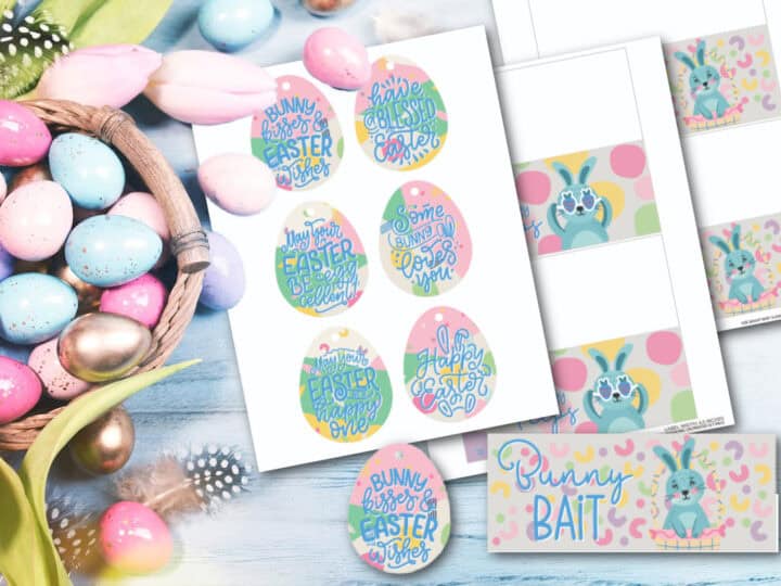 A collection of colorful Easter-themed printables and buttons on a wooden surface. Includes egg-shaped designs with phrases like Bunny Kisses and Happy Easter, alongside a Bunny Bait label and pastel-colored Easter eggs in a basket.