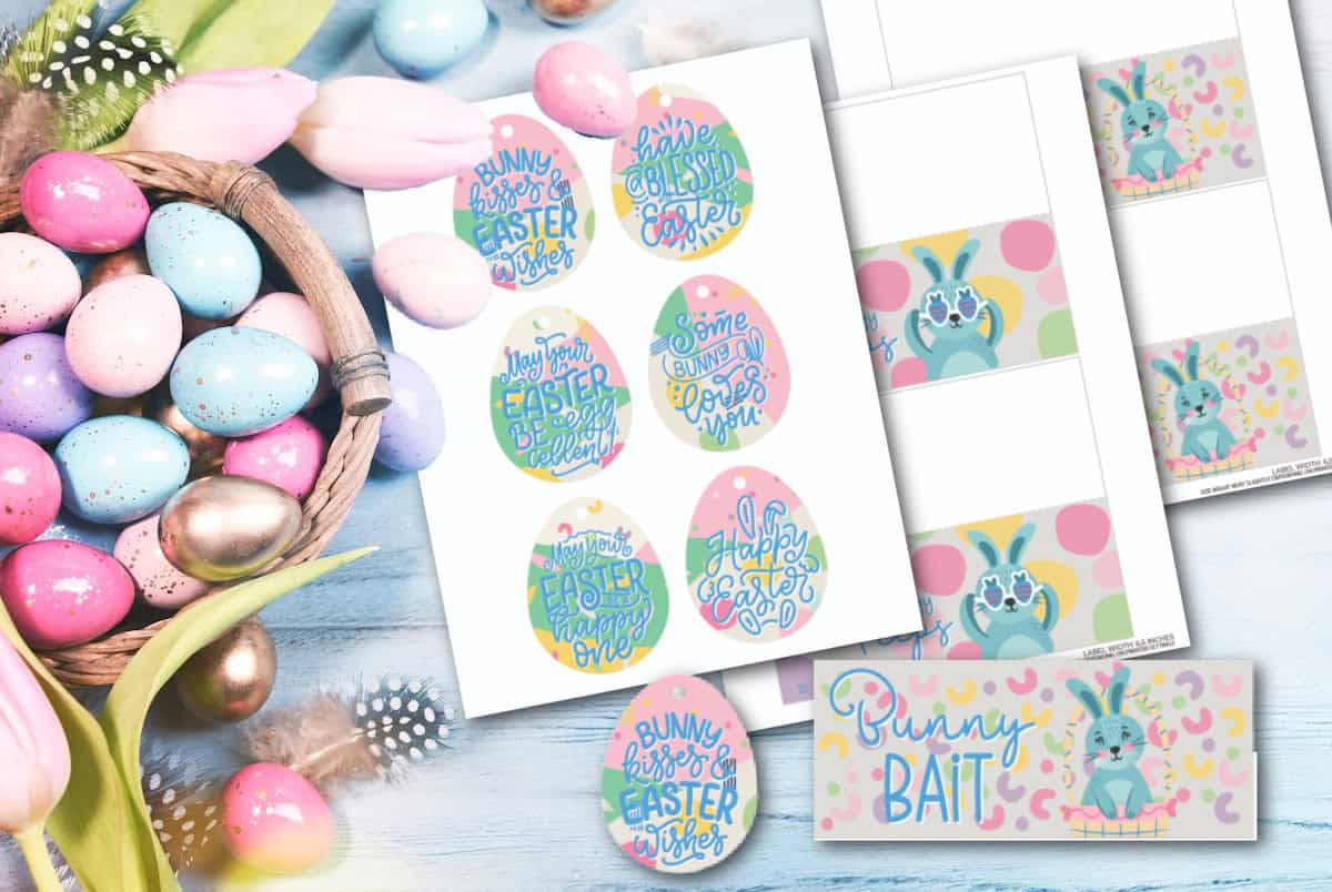 A collection of colorful Easter-themed printables and buttons on a wooden surface. Includes egg-shaped designs with phrases like Bunny Kisses and Happy Easter, alongside a Bunny Bait label and pastel-colored Easter eggs in a basket.