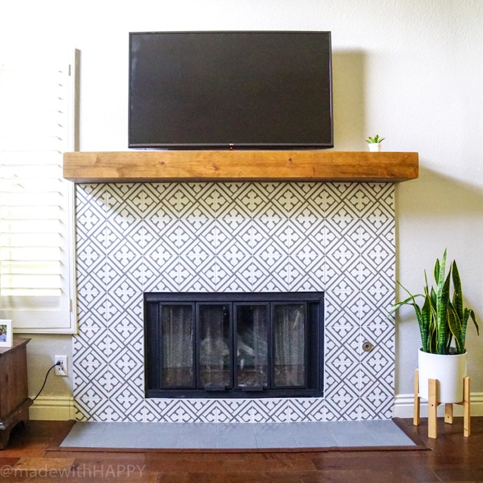 Modern Fireplace Makeover. Just like cement tile fireplace, but Portuguese ceramic tile fireplace. Modern Grey and white patterned tile. Rustic Mantel. Chunky reclaimed wood mantel. 