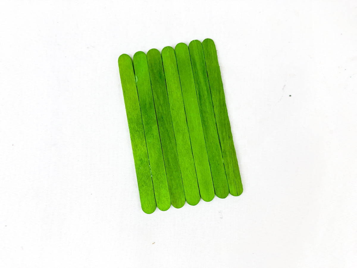 flip over green craft sticks for frankenstein face