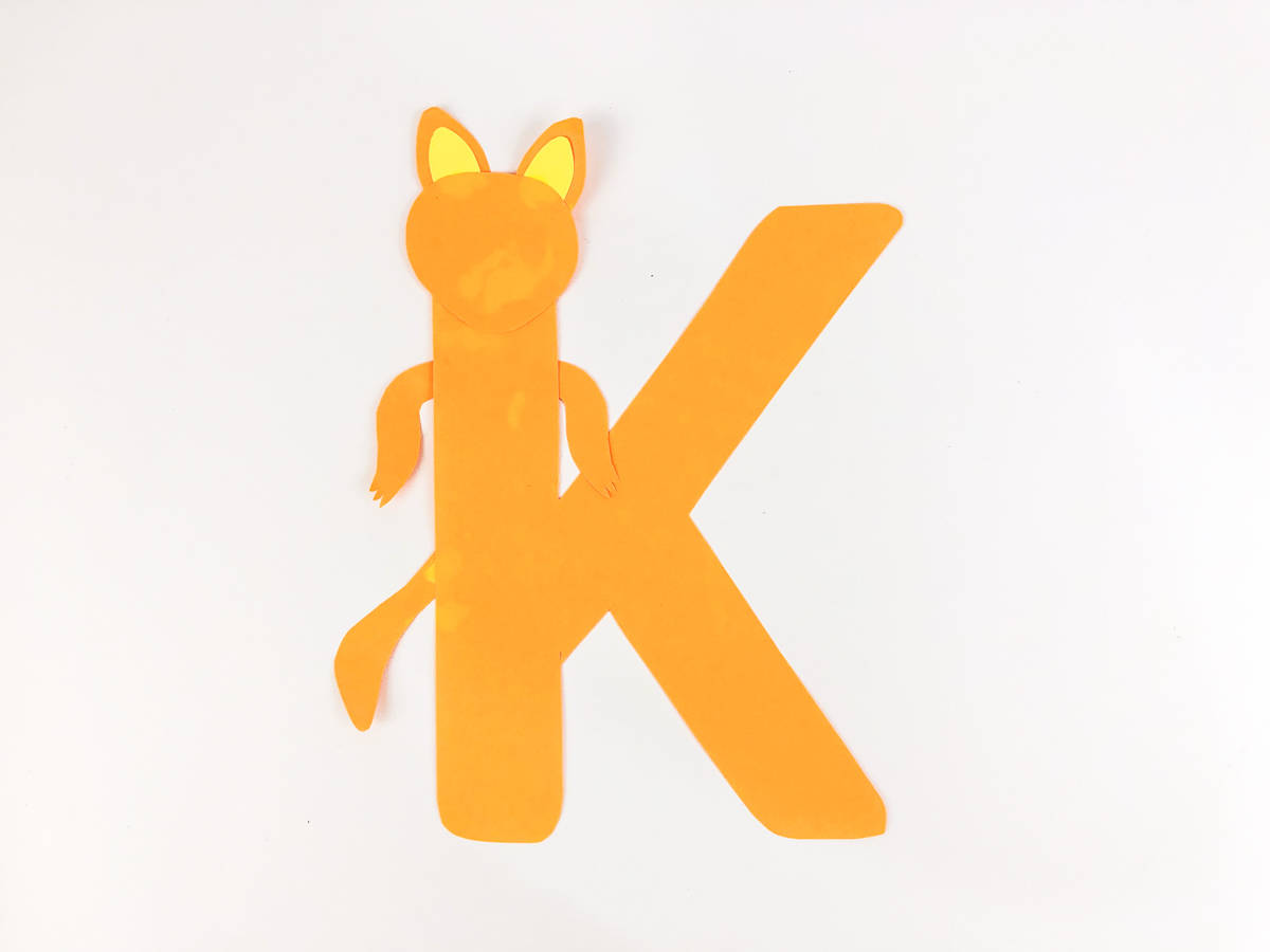 glue kangaroo head arms and tail to K