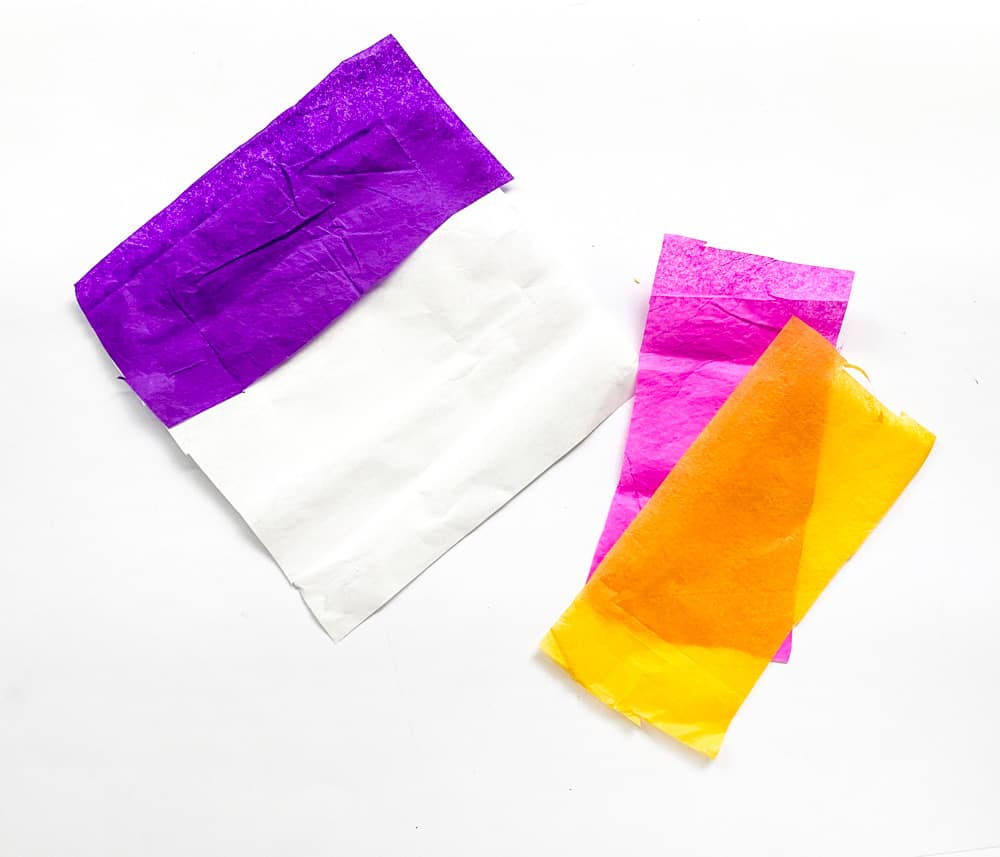 Take a white tissue paper according to the size of the square-shaped gap on the template. Start glueing the colourful tissue papers on the white tissue paper.