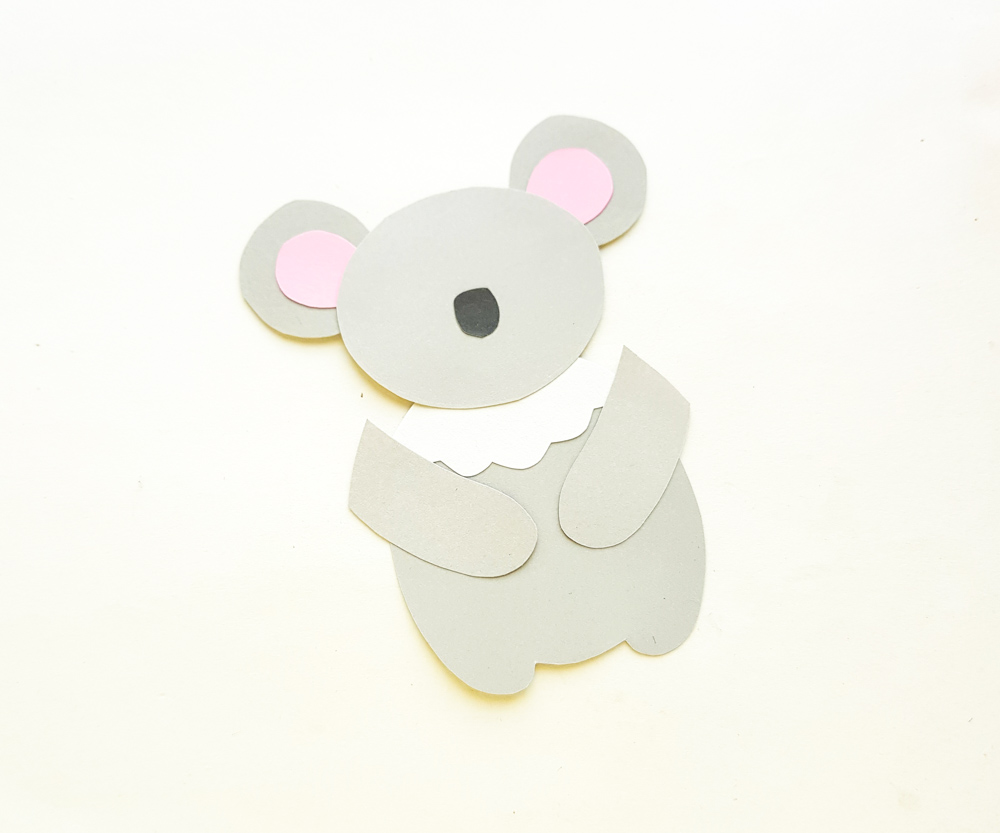 koala arms attached to paper body