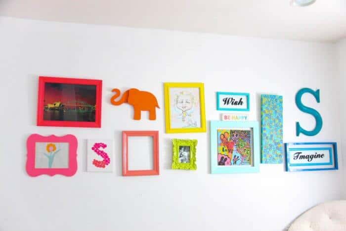 Rainbow Gallery Wall | Bright and colorful decoration ideas. Fun bright gallery walls | Colorful wall ideas | www.madewithhappy.com