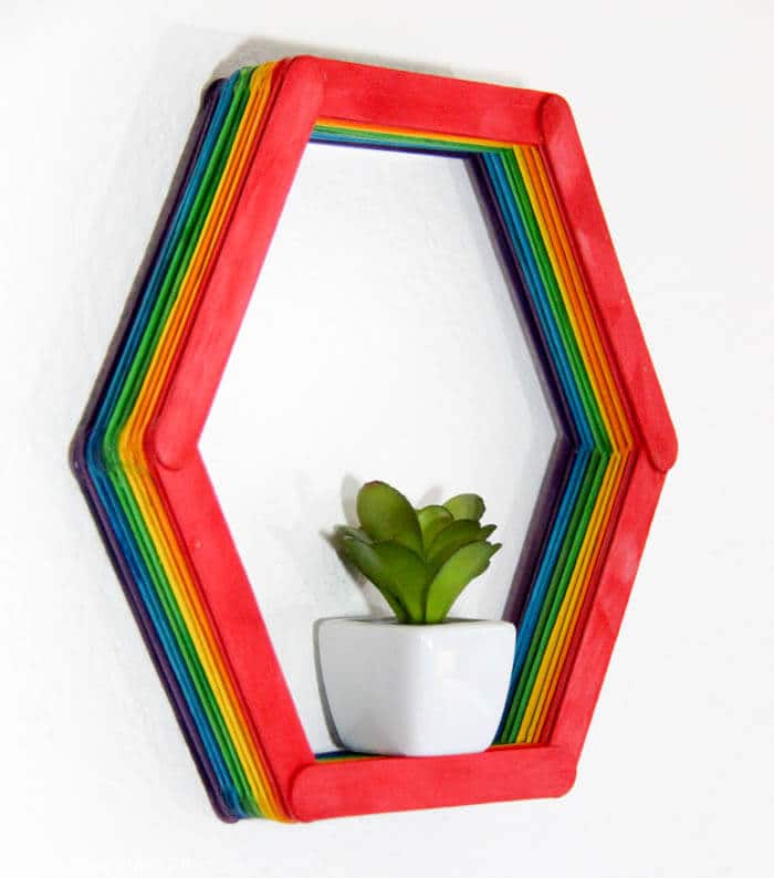 Modern Shelf DIY. Making a small hexagon shelf out of popsicle sticks. Rainbow shelves. Home DIY | Modern Popsicle Shelf | www.madewithhappy.com