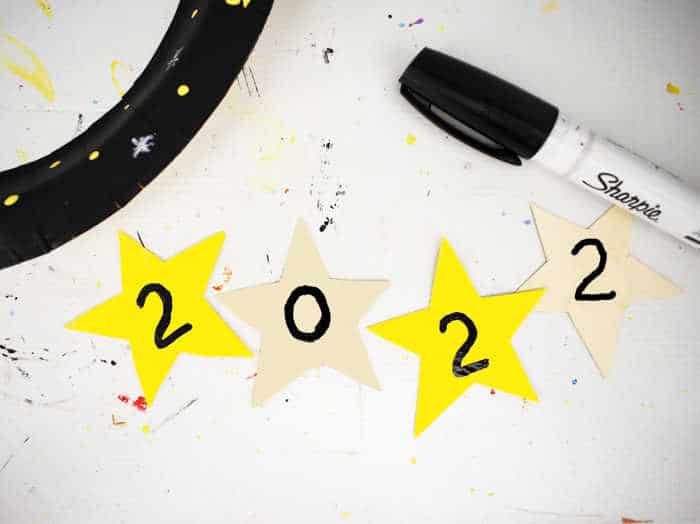 a number written on each of four stars to mark the year