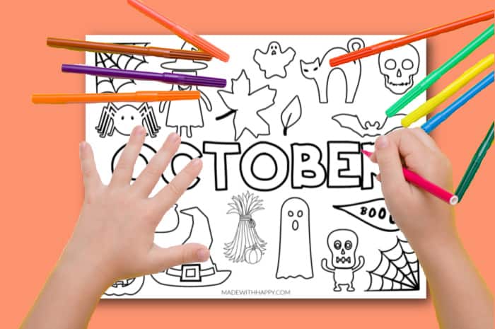 child coloring a October page