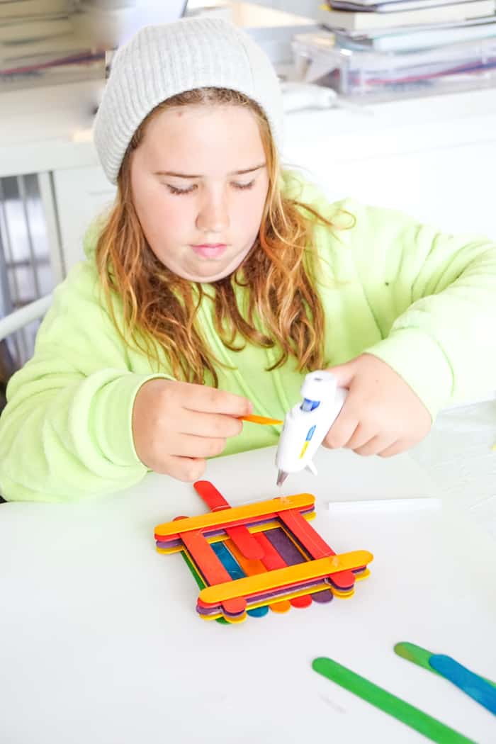 child making birdfeeder