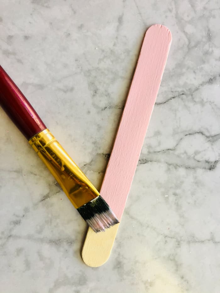painting popsicle stick pink