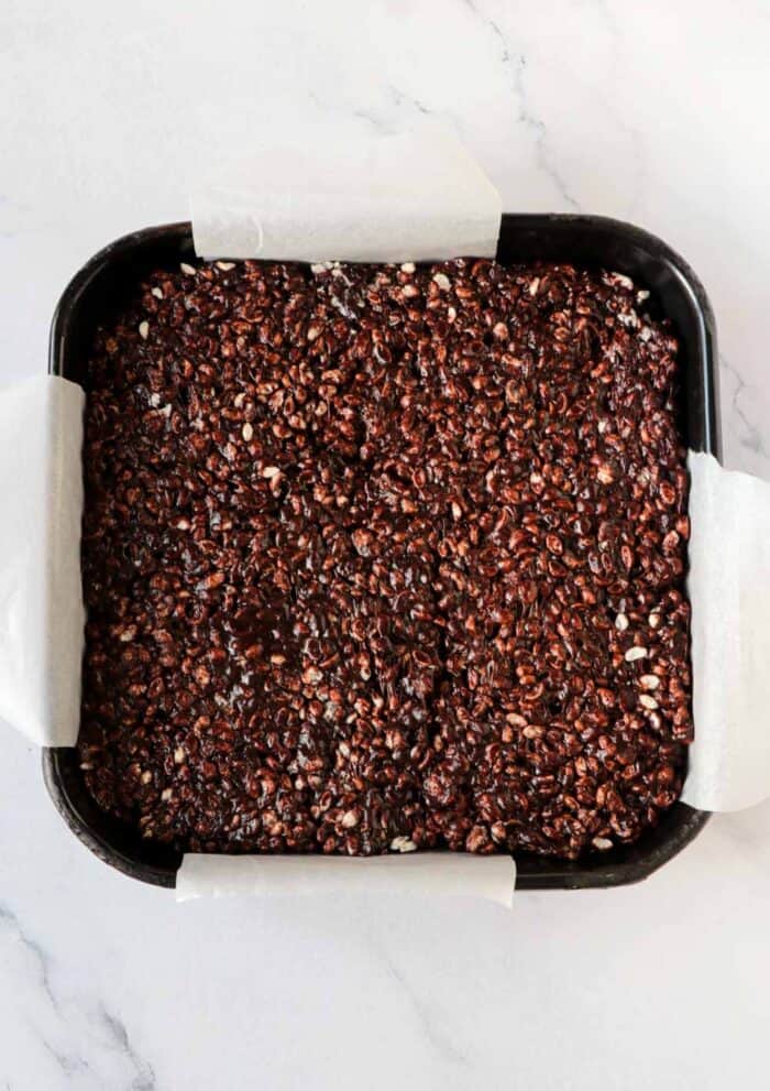 press chocolate rice krispie treats into pan