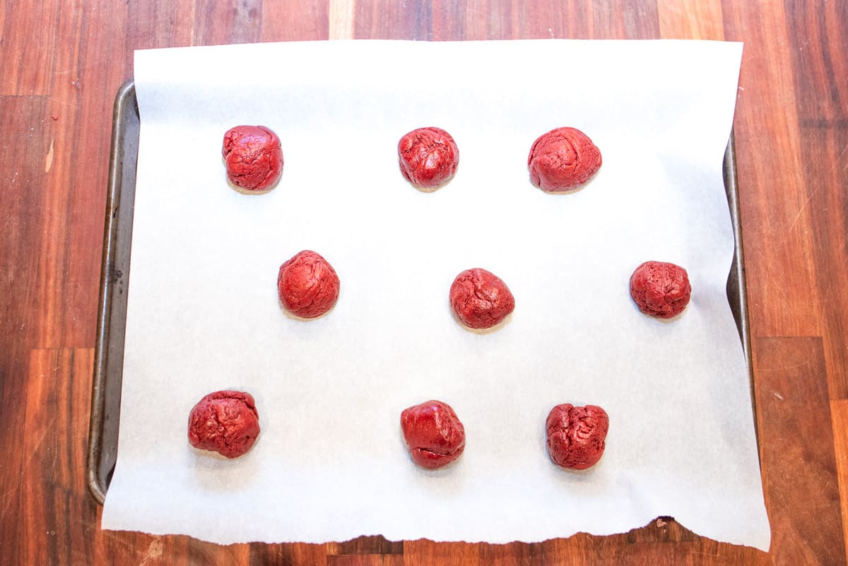 red velvet sprinkle cookies with white chocolate rolled cookie dough