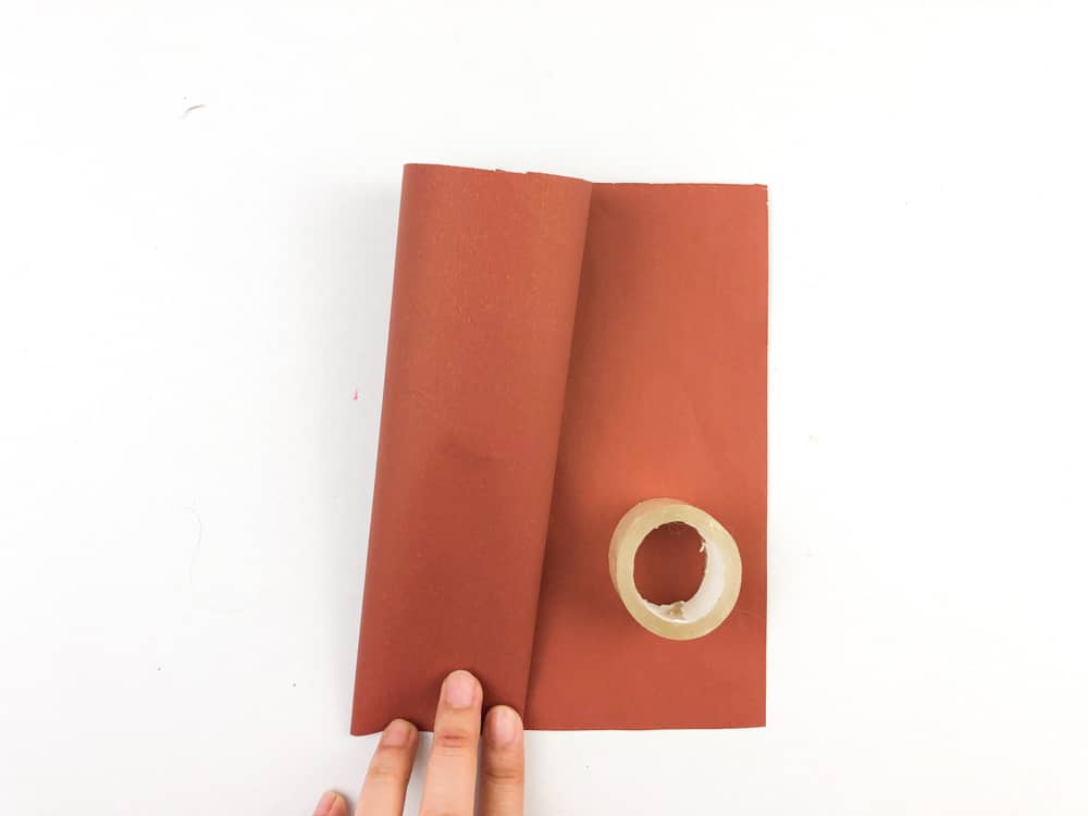 roll brown paper into a cone shape