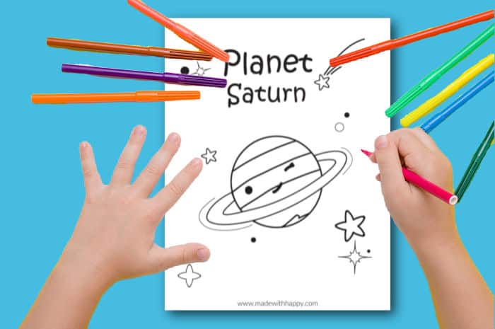 Kids coloring a picture of saturn
