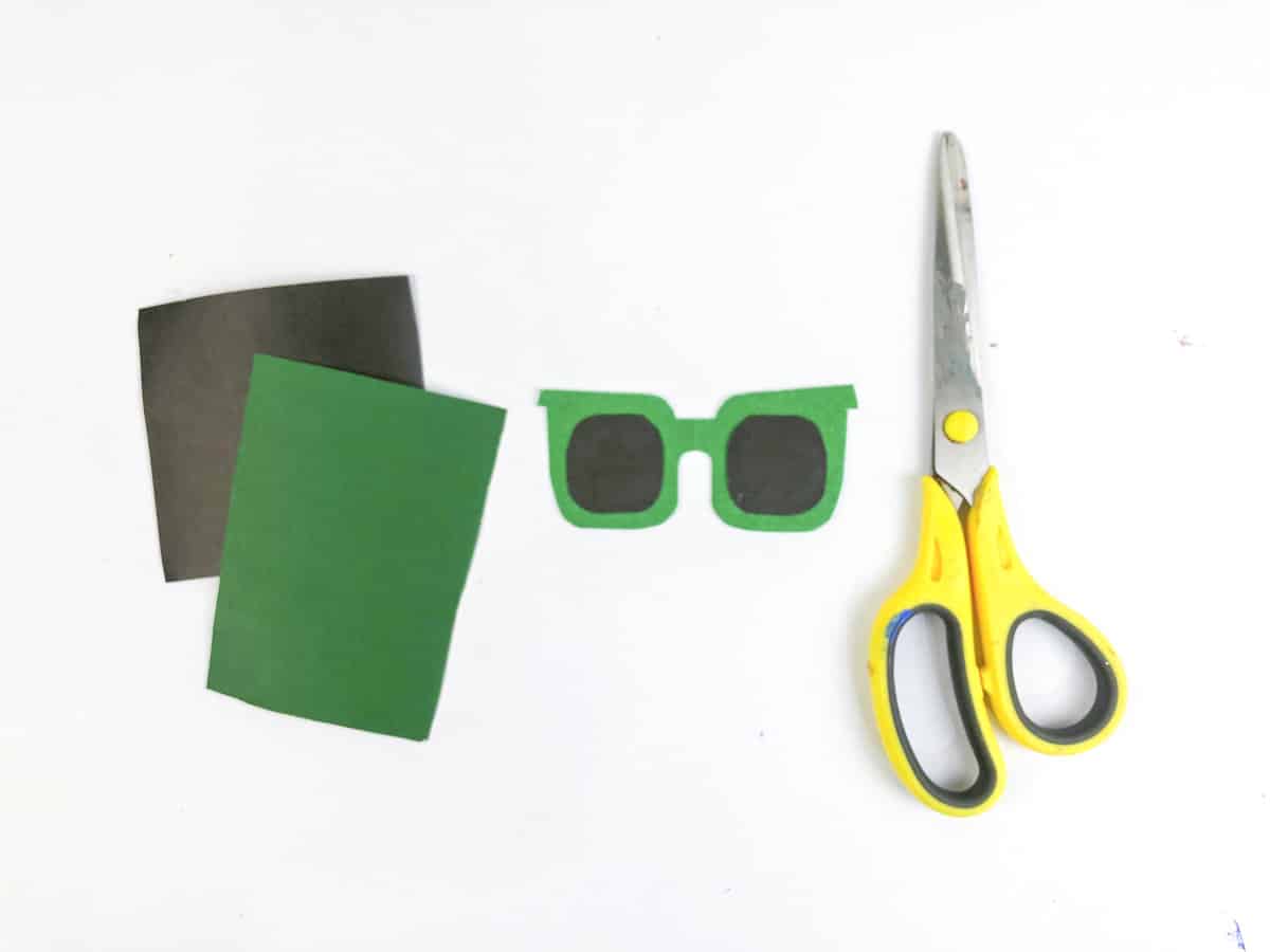 step 4 cut sunglasses out of black and green paper