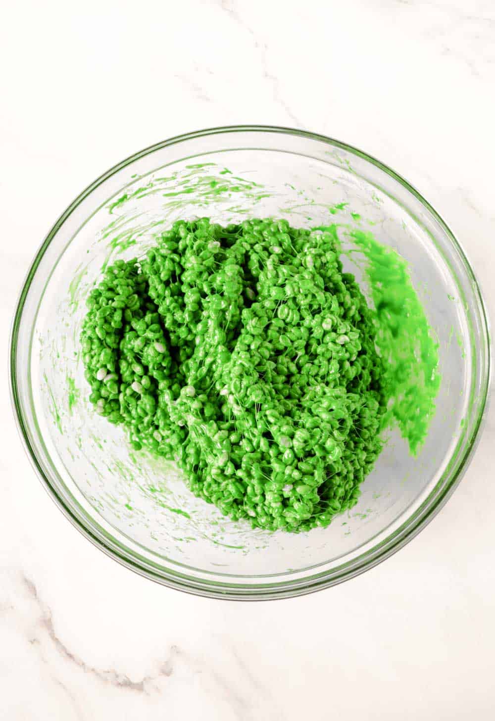 stir till it is completely combined making green rice crispy treats
