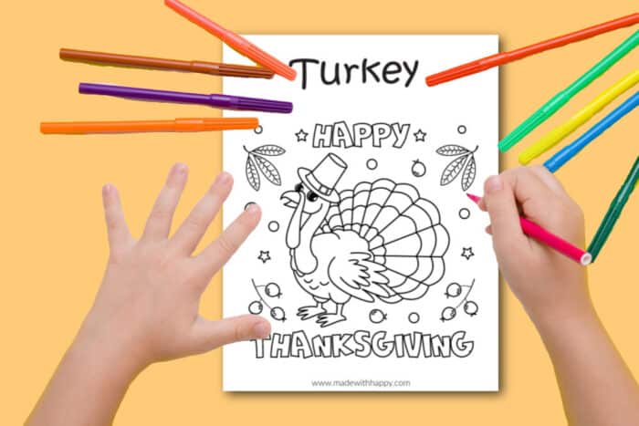 Child coloring a turkey coloring page