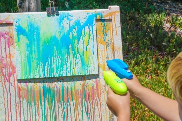 Squirt Gun Painting Kids Activity. Water gun painting. Looking for Summer activities for the kids? The kids LOVE water gun painting throughout the Summer.