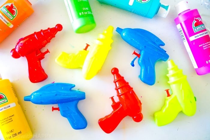 Squirt Gun Painting. Water gun painting. Looking for Summer activities for the kids? The kids LOVE water gun painting throughout the Summer.
