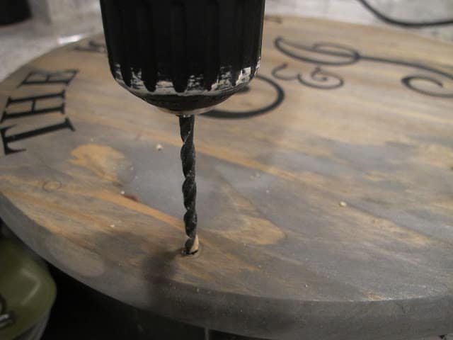 drilling holes in wine barrel
