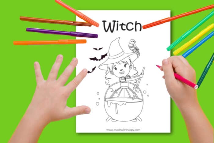 child coloring a witch coloring page