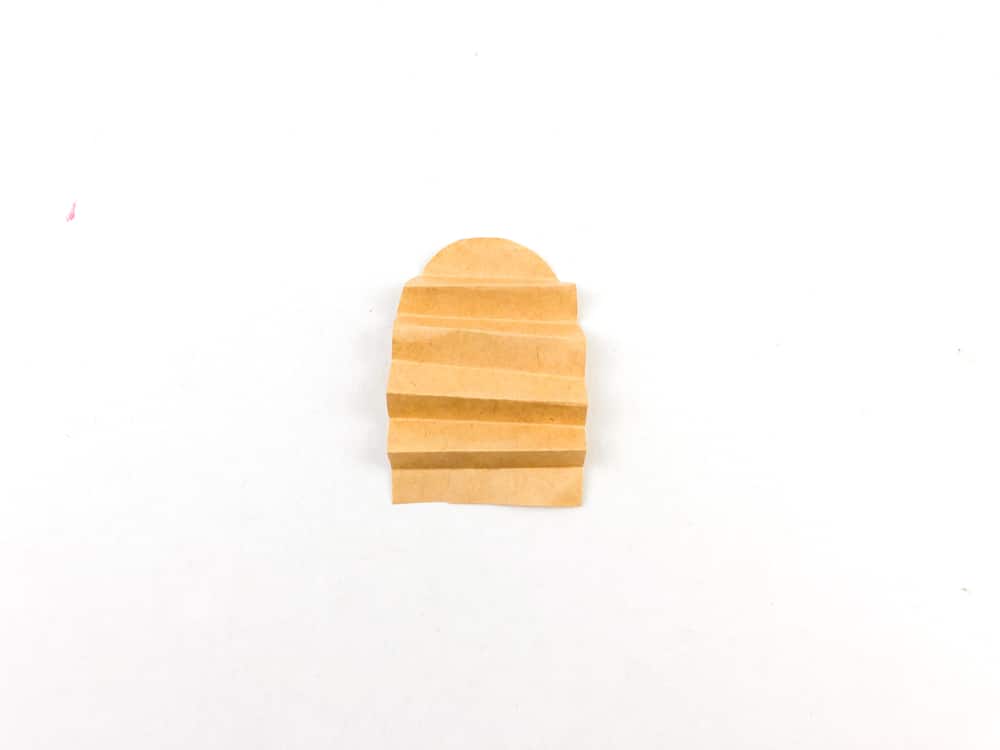 accordion fold rainbow shaped light brown paper