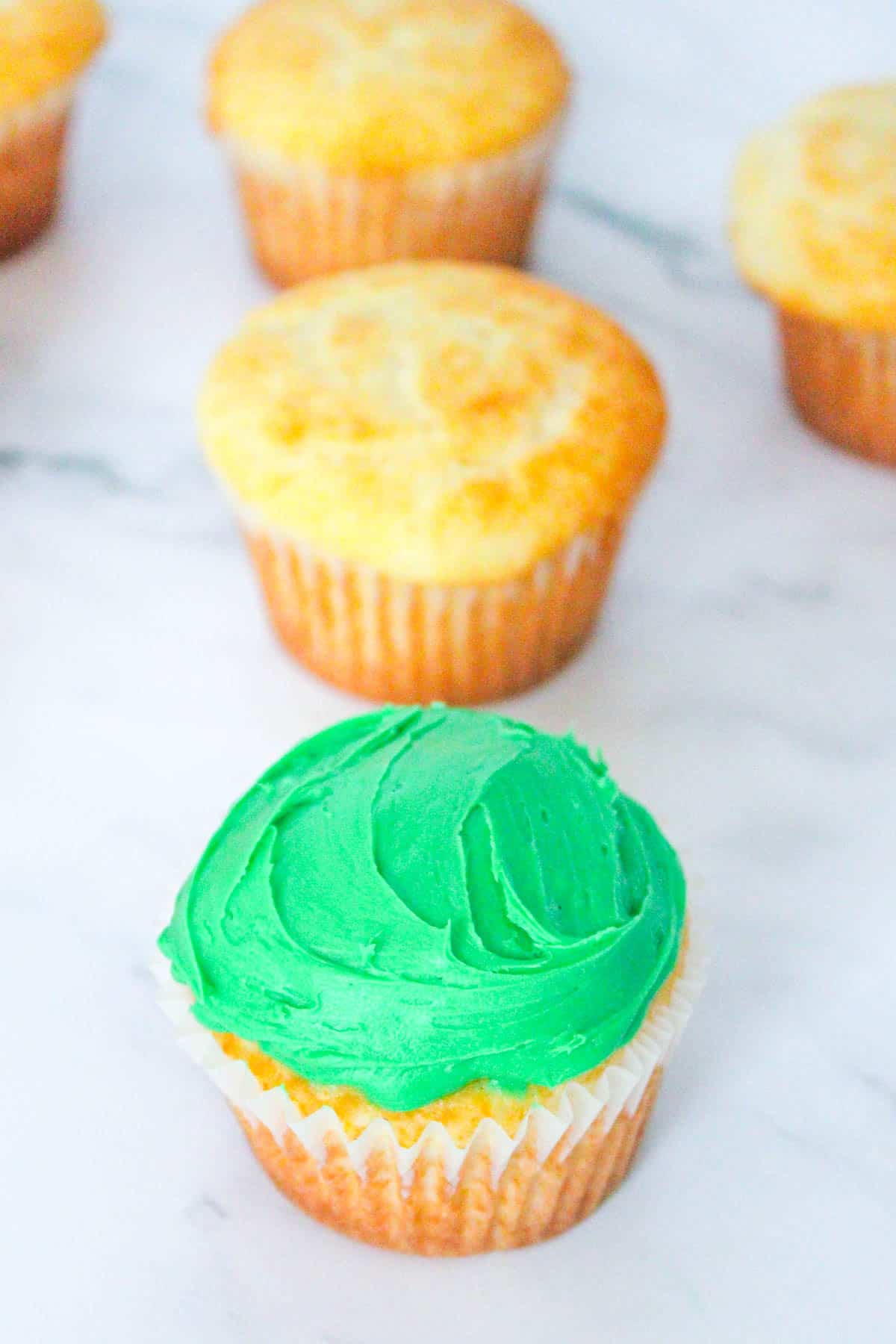 add green frosting to pot of gold cupcakes