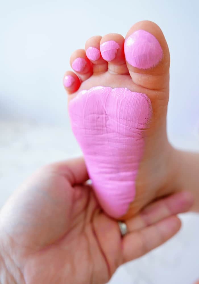 add pink paint to bottom of baby foot