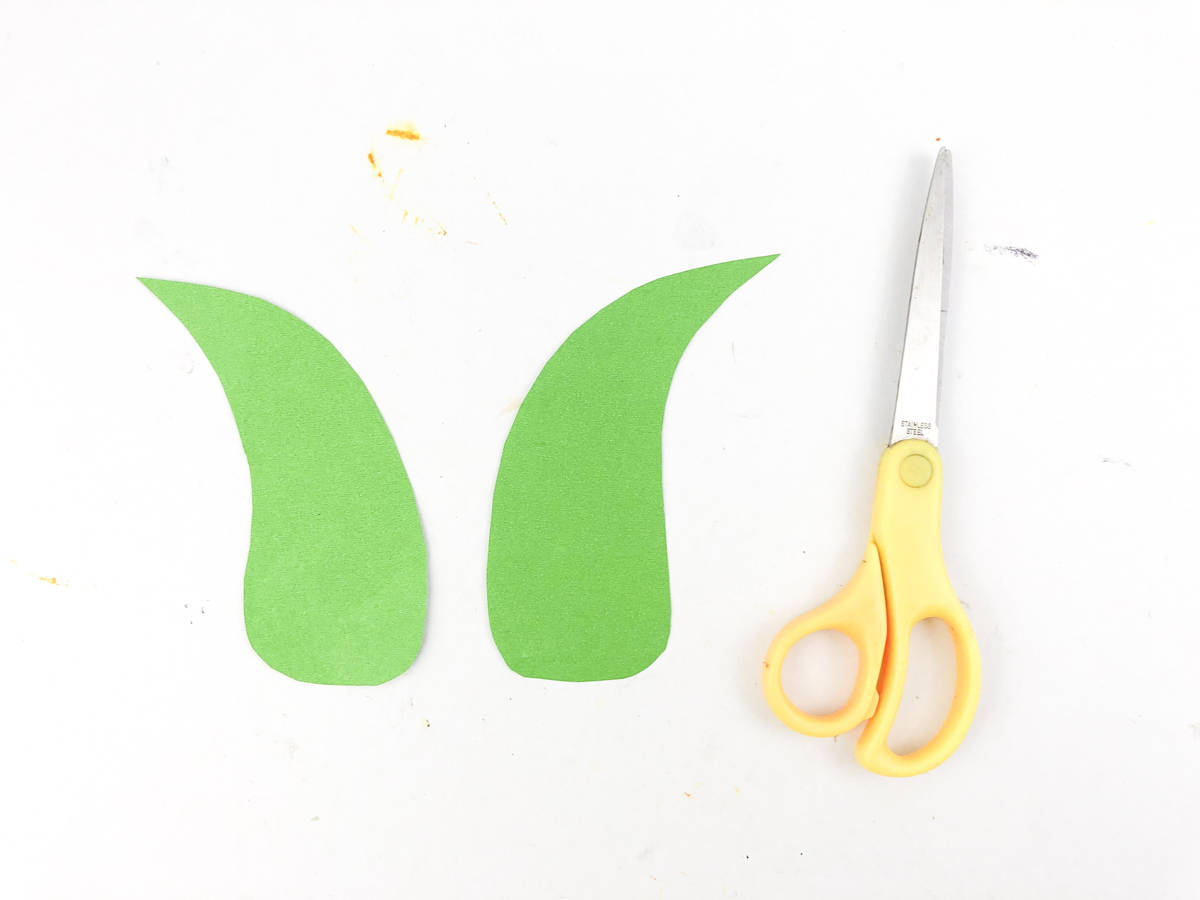 cut out two corn husk out of green paper