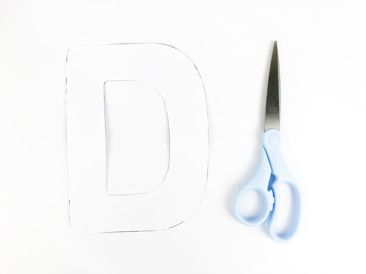 cut out white uppercase D