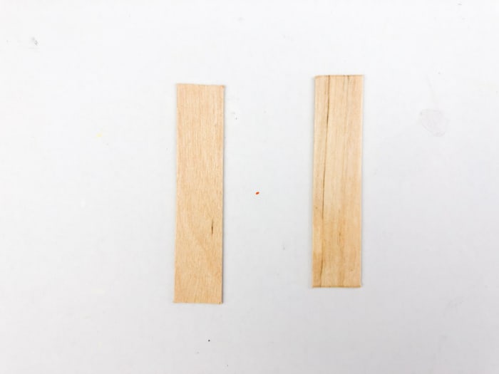 cut tips off both sides of popsicle sticks
