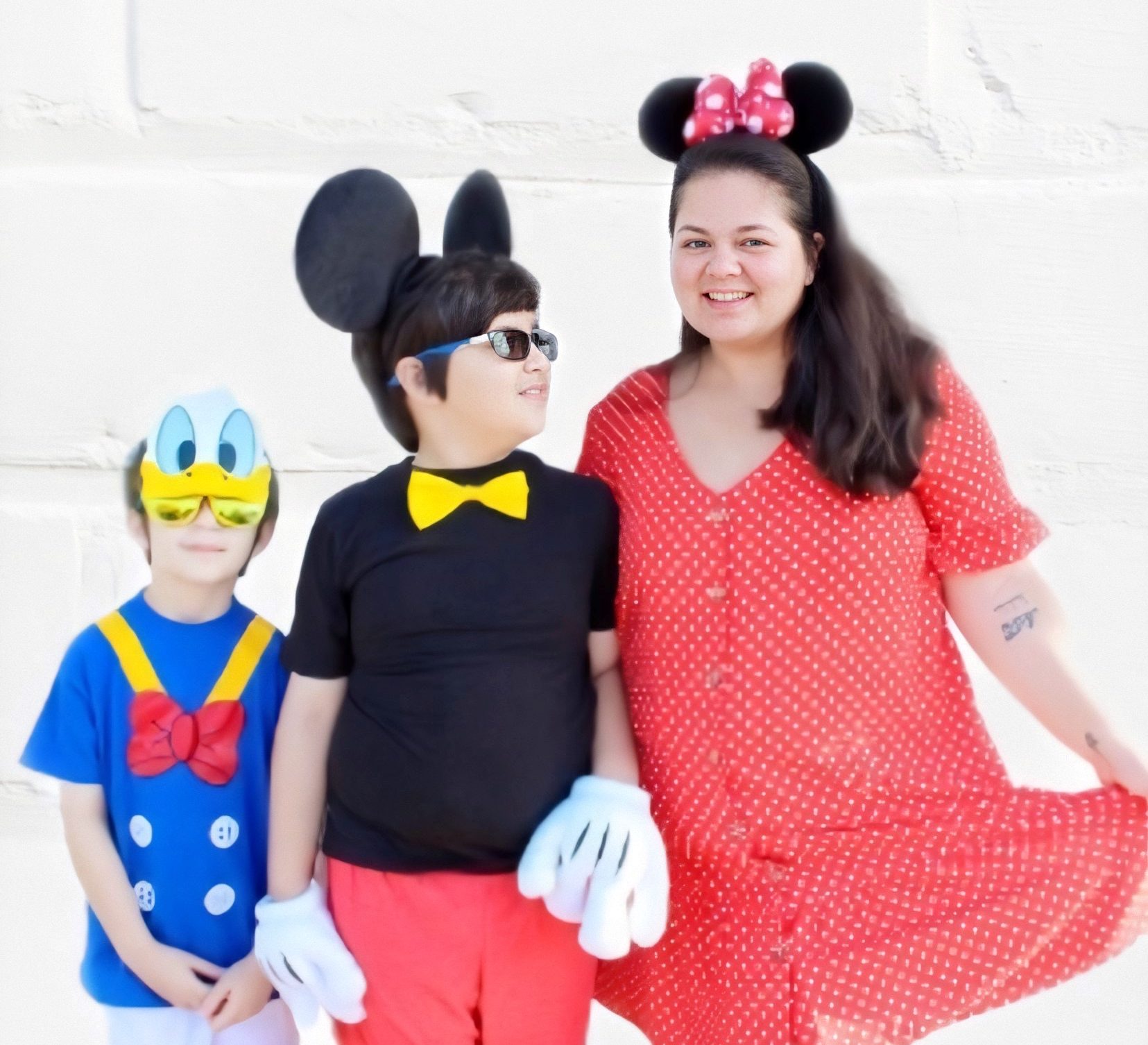 mom and sons dressed as Donald Duck, Mickey Mouse and Minnie Mouse