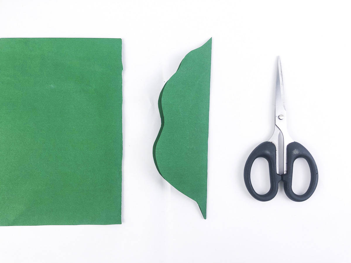 fold dark green paper and cut out leaf