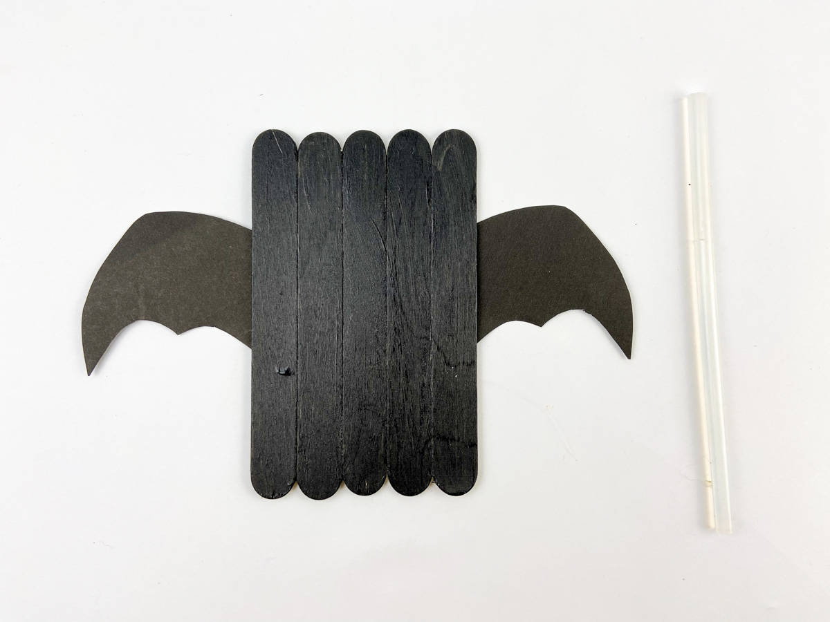 glue bat wings to back of popsicle sticks