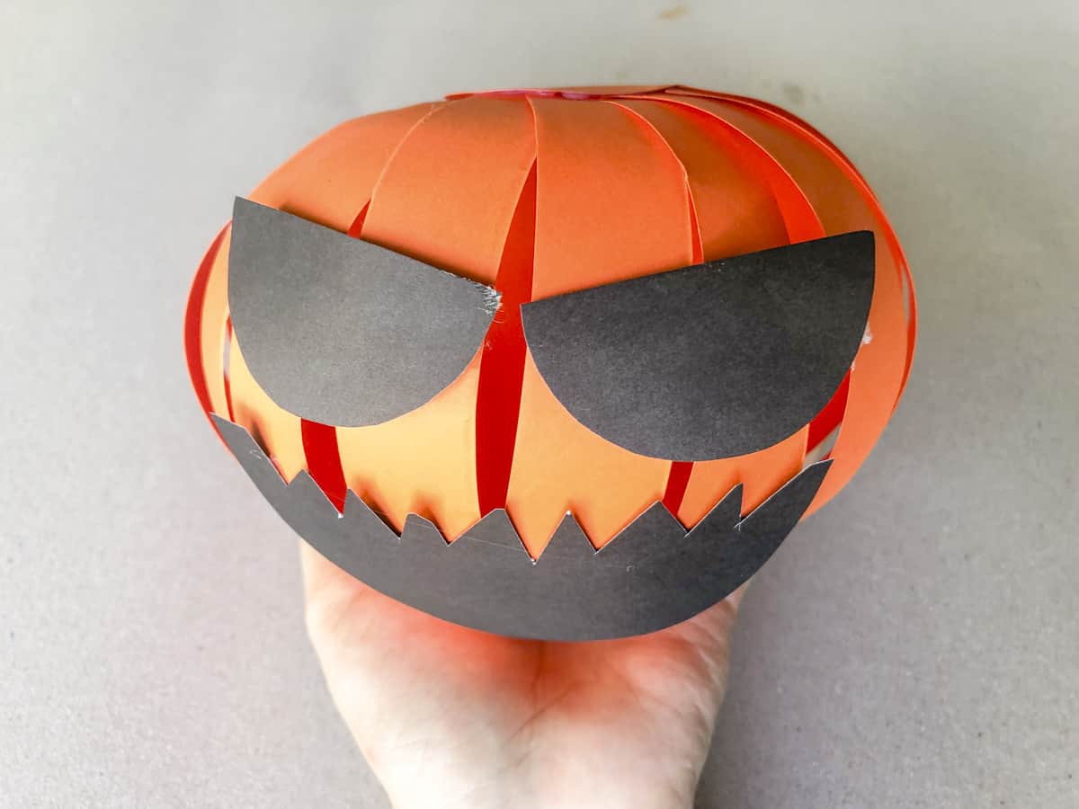 glue black face to front of 3D pumpkin
