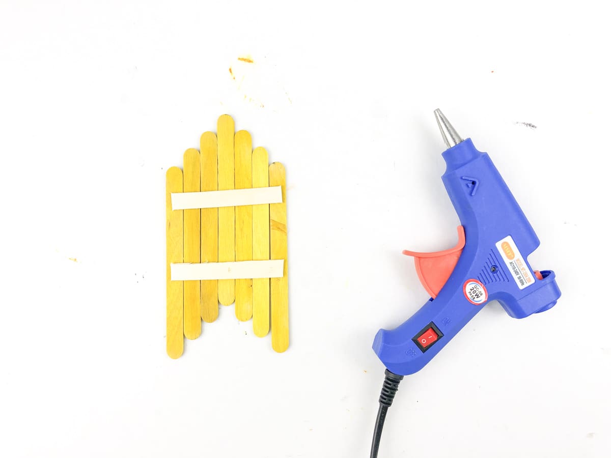 glue corn craft sticks together with additional popsicle stick