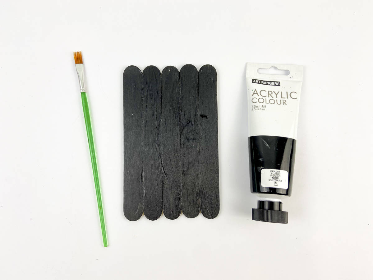 glue craft sticks together for bat then paint the sticks black