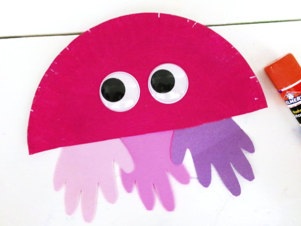 glue eyes on jellyfish craft