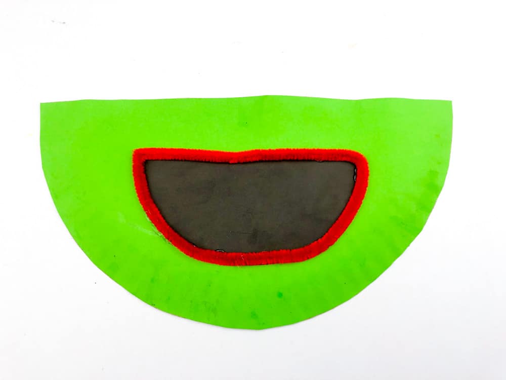 glue frog mouth to paper plate