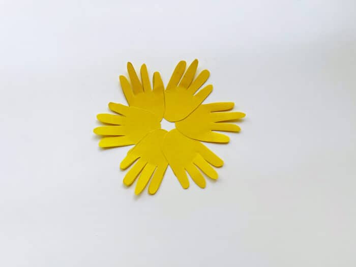 glue hands together in flower shape
