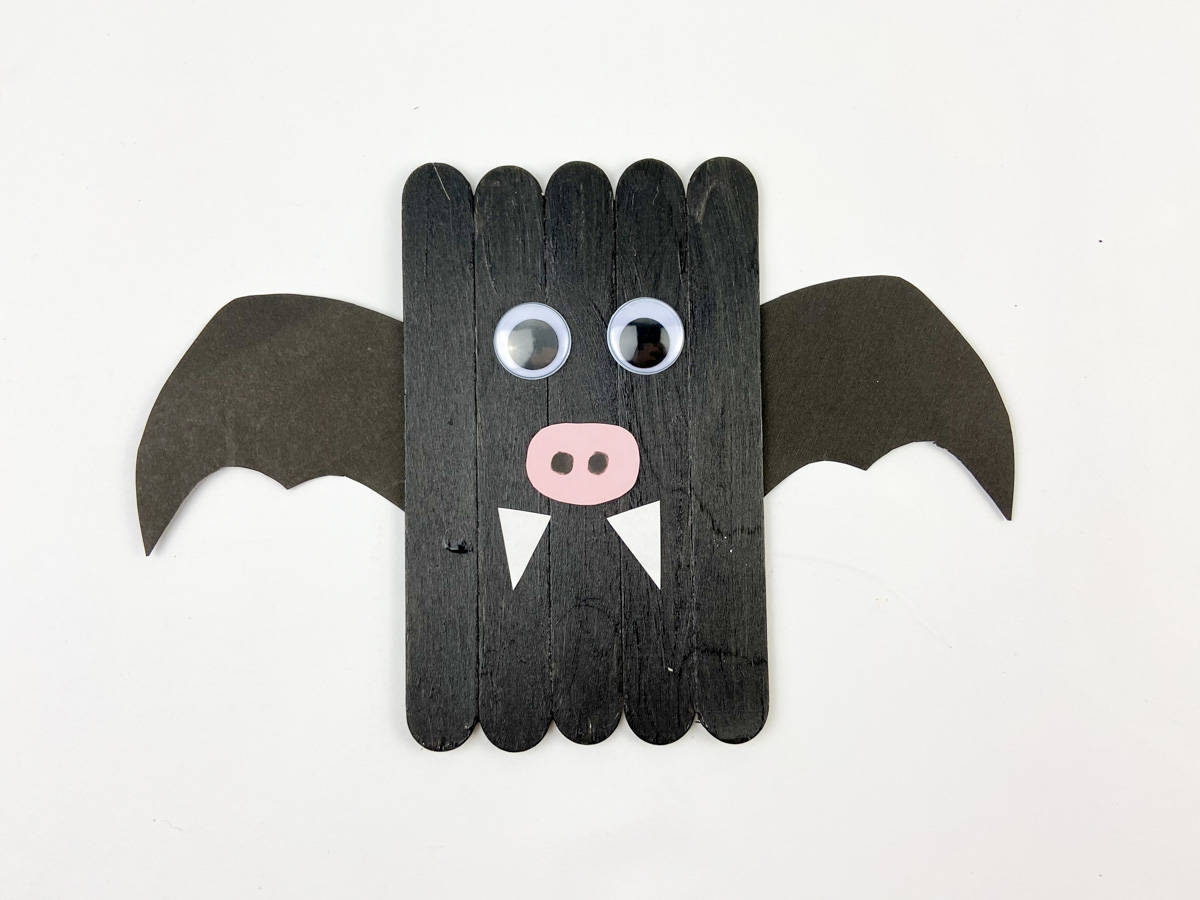 glue on fangs to craft stick bat