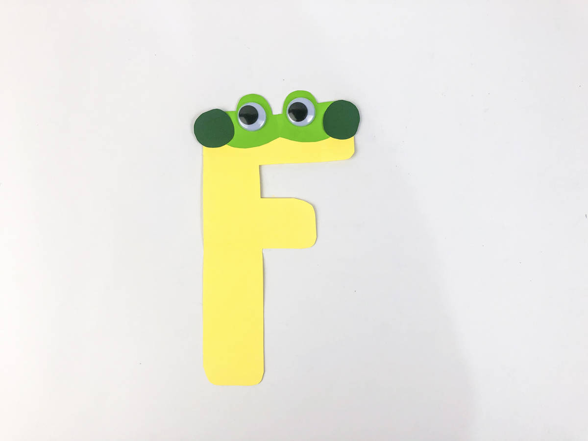 glue on googly eyes to frog